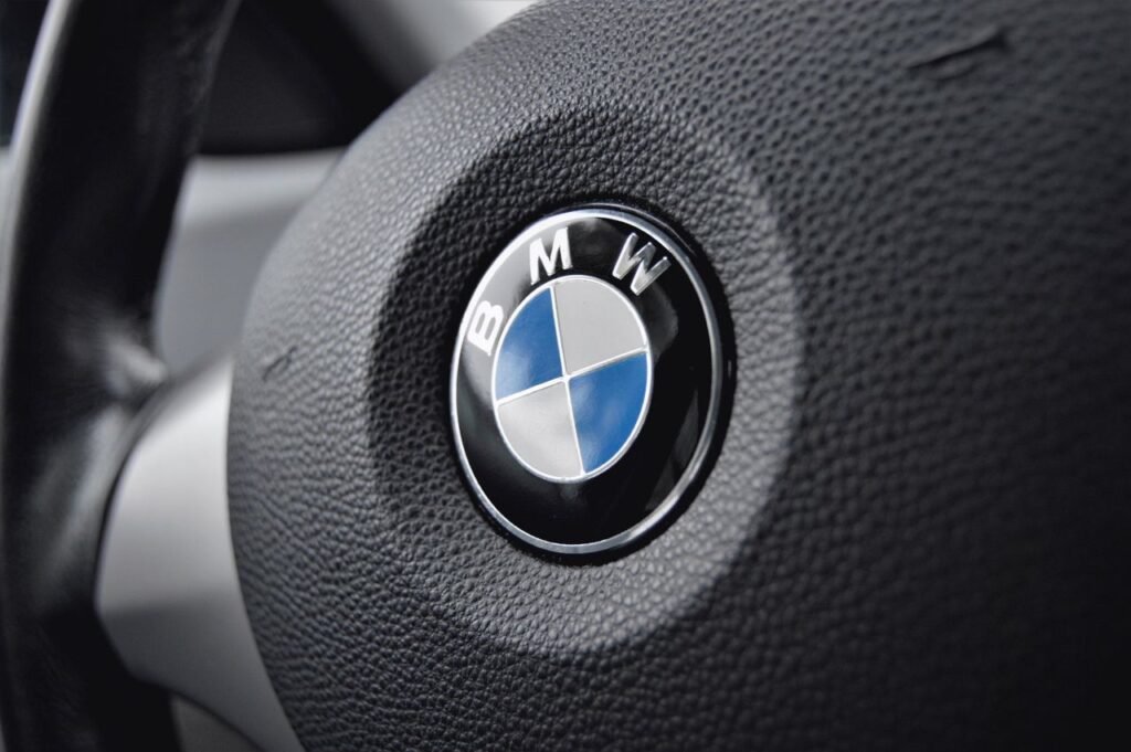 More than 4,000 pass Mon region-wide summer Mon language examination Detailed view of a BMW steering wheel with focus on the emblem showcasing luxury and design.